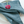 Blue napkin with a pink flower on a white plate