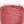 Close-up of a pink fabric with frayed edges on a white background