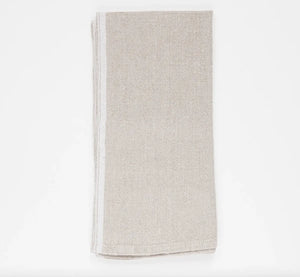 Folded beige napkin on a white background