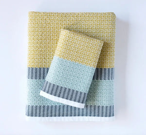 Set of towels with multicolor pattern on a white background