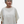 Woman wearing an off white boxy top against a white background