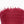 Close-up of a red textured fabric with frayed edges on a white background