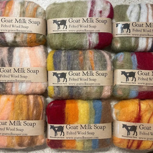 Three rows of felted wool soap bars in multicolored patterns