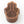 Wooden Hamsa hand with eye design on a white background