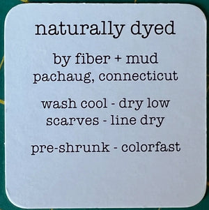 Text label on a white background indicating 'naturally dyed' by fiber and mud from Pachaug, Connecticut.