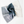 Folded denim fabric on a white background