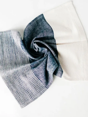 Folded denim fabric on a white background