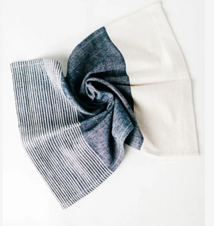 Folded denim fabric on a white background