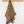 Striped yellow towel hanging on a wooden rack against a white background
