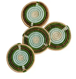 Set of four multicolor round woven coasters with green and brown patterns on a white background